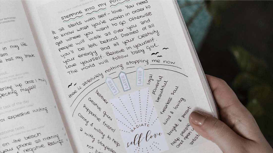 Image of an open journal, a tool used in planning for wellness.